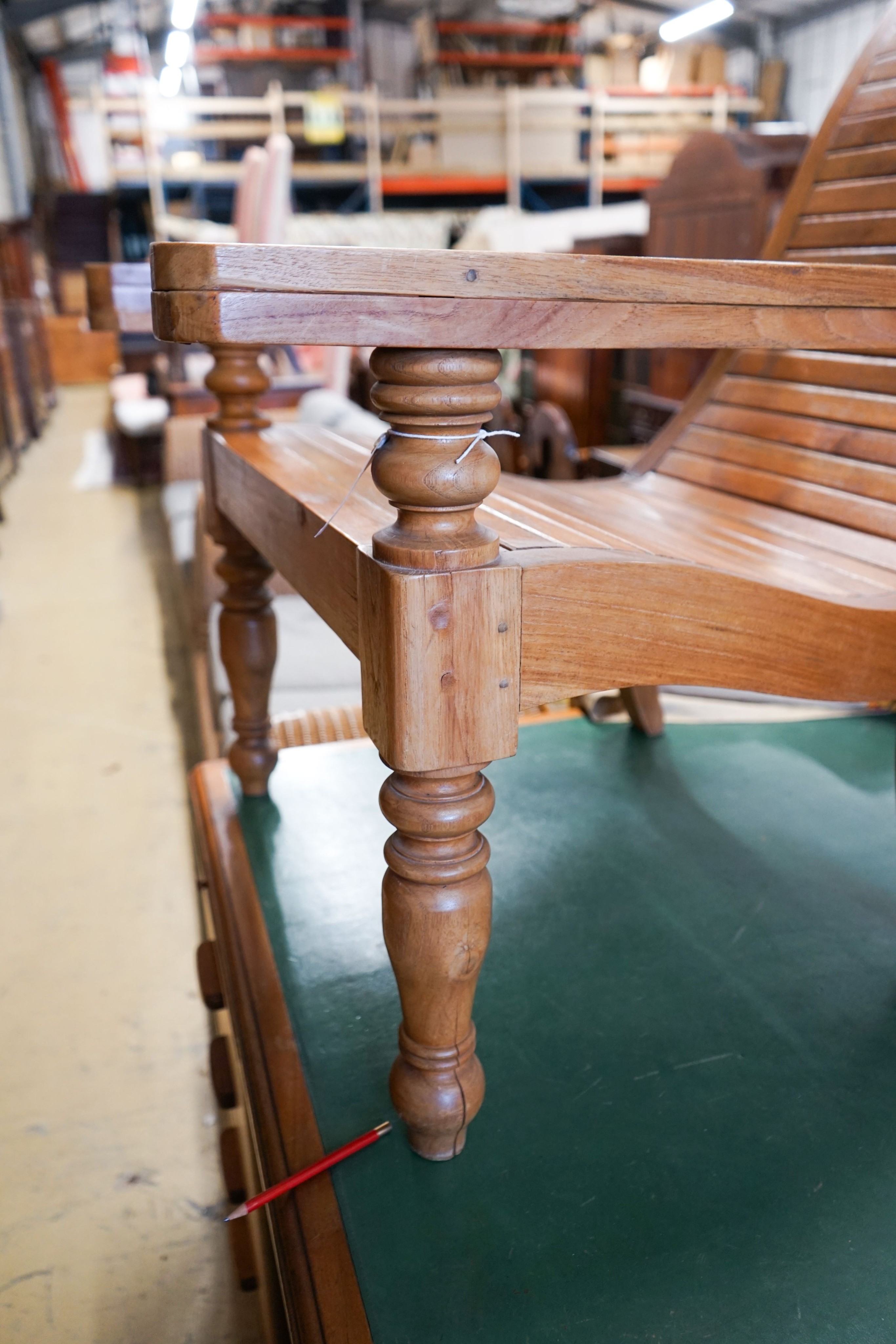 A hardwood plantation chair, width 73cm, depth 110cm, height 104cm